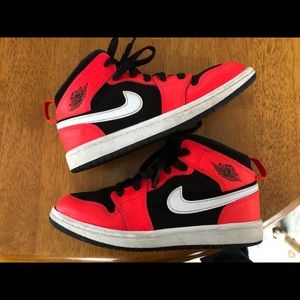 Jordan 1 infrared and black sneakers.